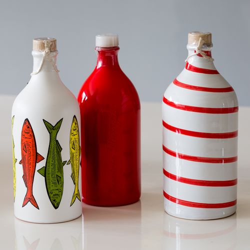 OLIVE OIL IN HAND MADE TERRACOTTA BOTTLES.